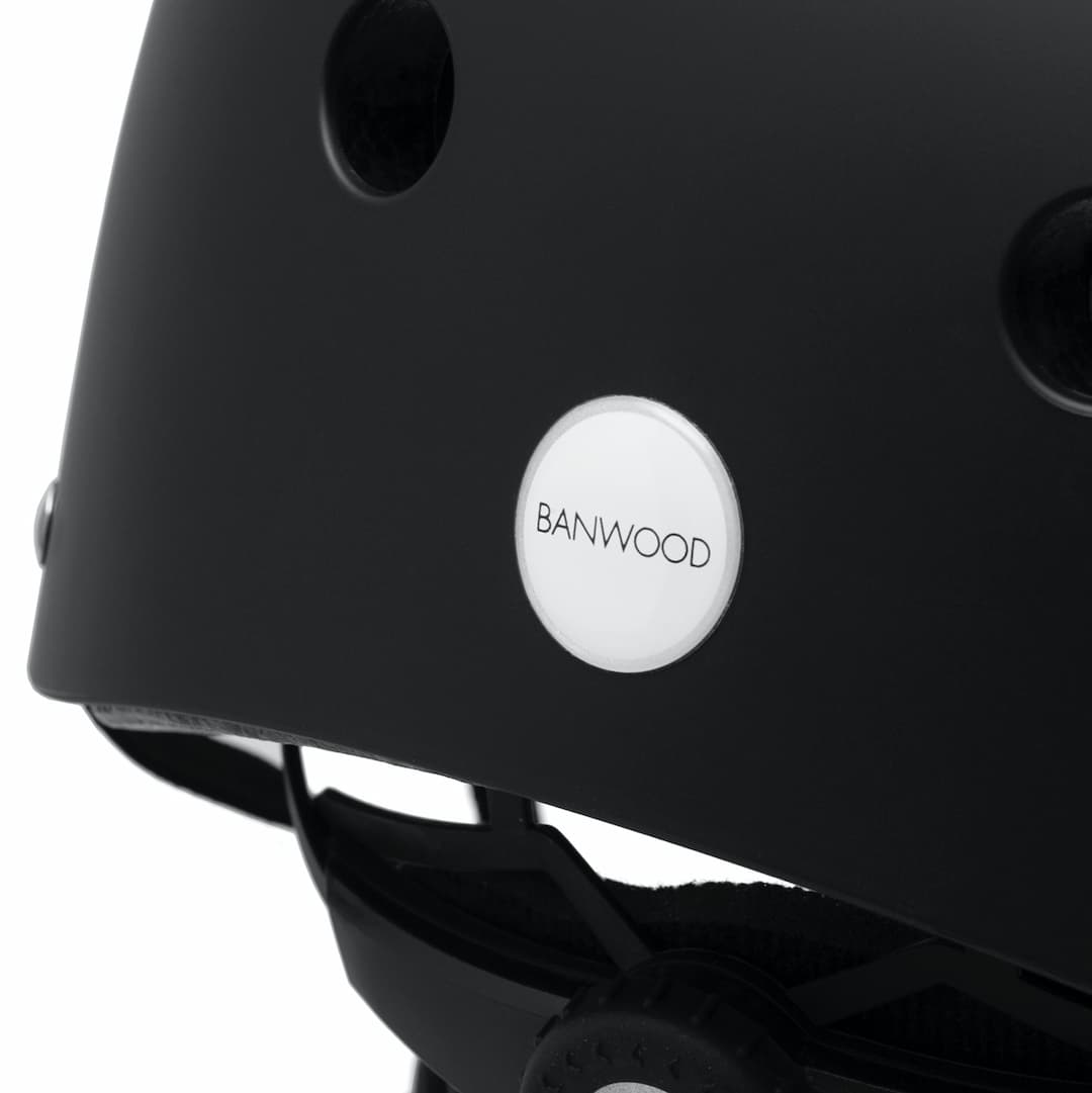 Close up of Banwood logo on matte black classic helmet