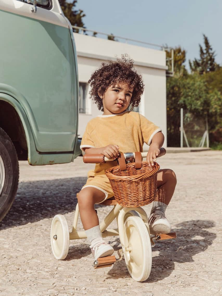 CHILD ON BANWOOD TRIKE