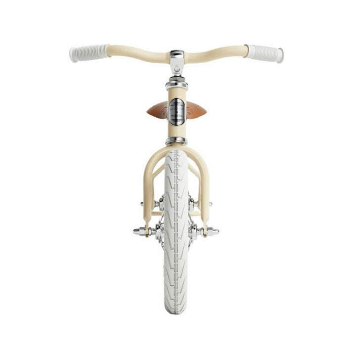 View of the front of the cream Banwood Icon Balance Bike